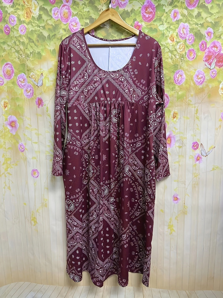 A woman wearing the Maureen long sleeve grey paisley midi dress with a square neckline and flowing skirt, styled for a relaxed day out.