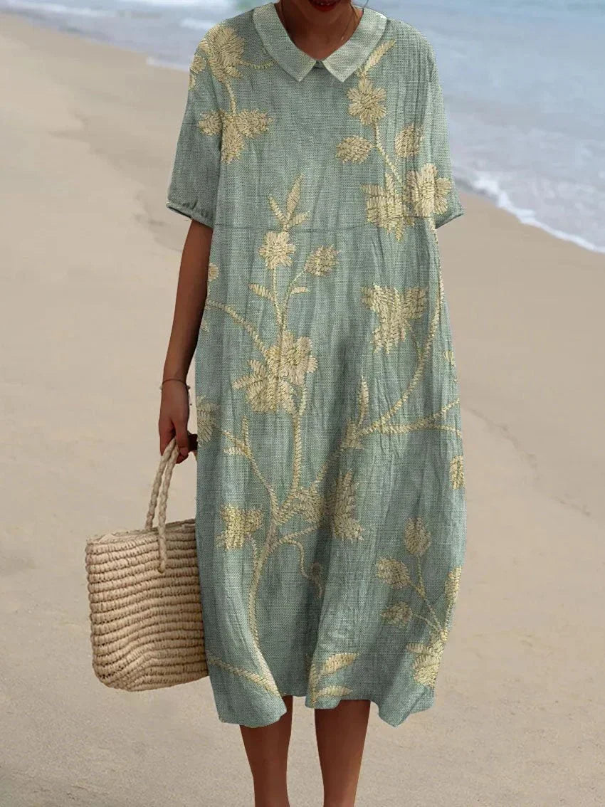 Relaxed day dress with delicate floral embroidery detail and a button back placket
