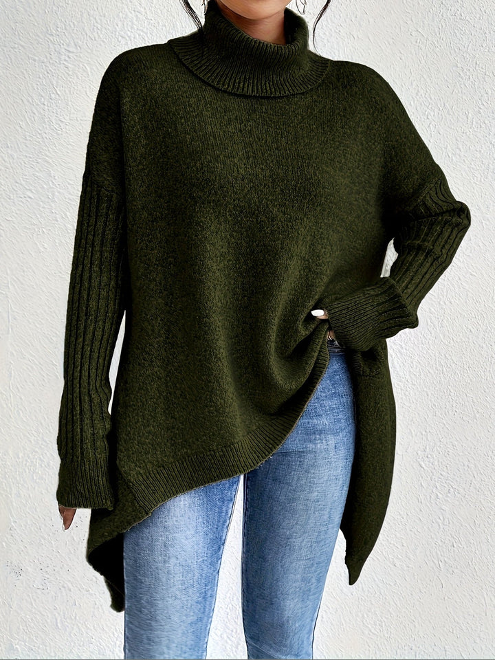 A woman wearing a stand-collar jumper with a chic asymmetric drape, warm and polished.