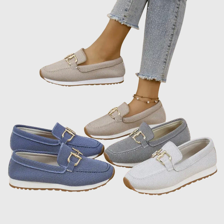 Women's beige comfort slip-on trainers with a cushioned sole and elegant metallic detail