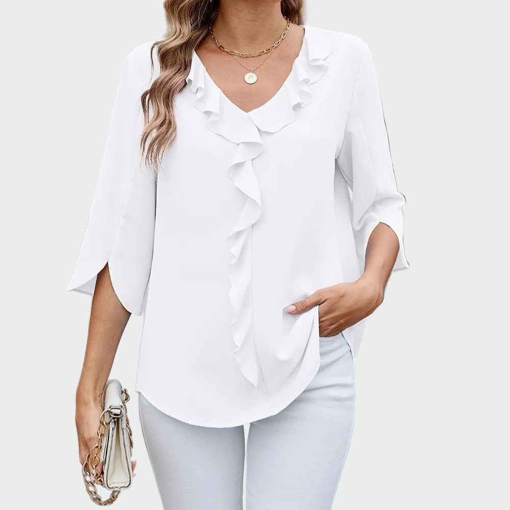 Elegant blouse with romantic ruffles at the V-neckline and three-quarter sleeves with a side split, shown in black