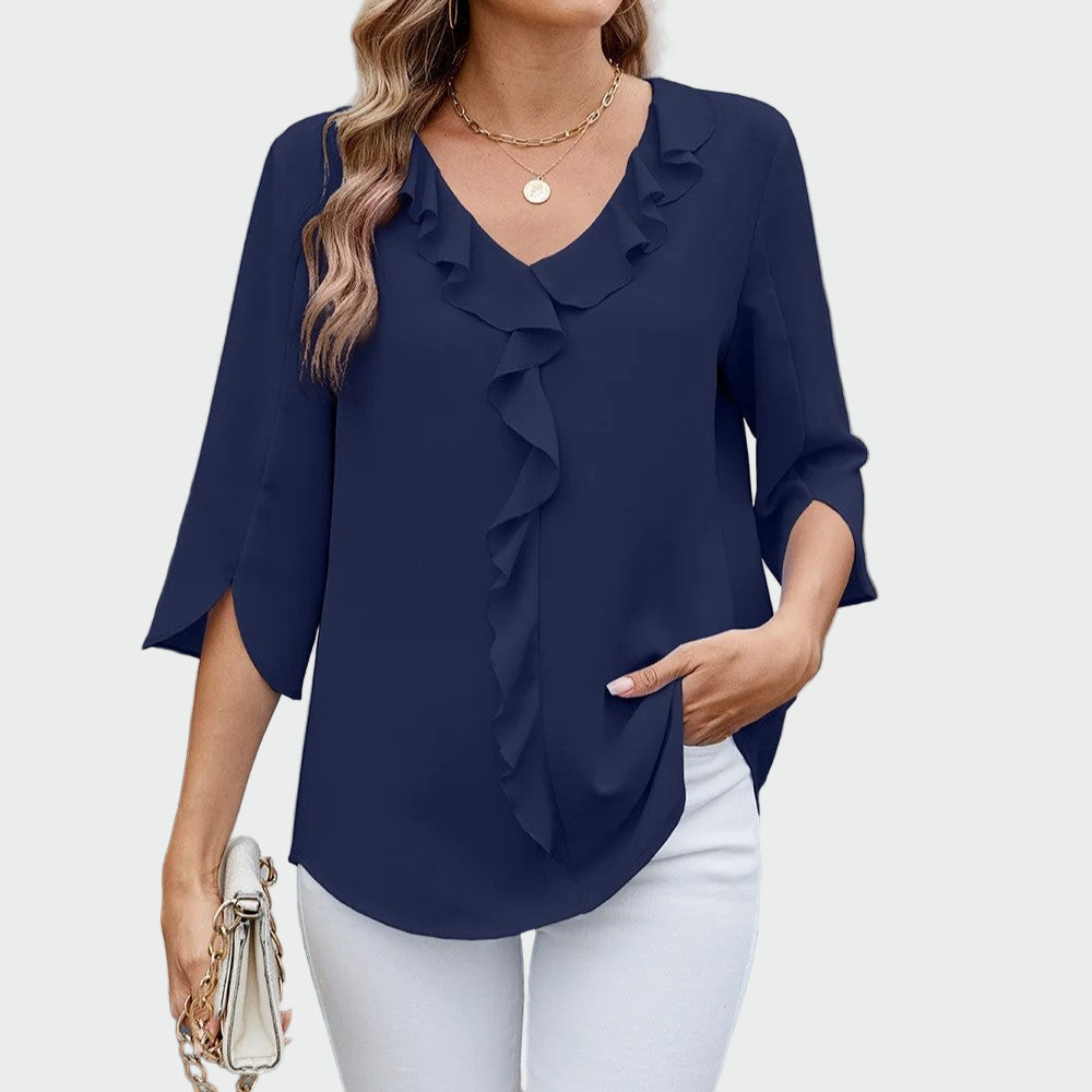 Elegant blouse with romantic ruffles at the V-neckline and three-quarter sleeves with a side split, shown in black