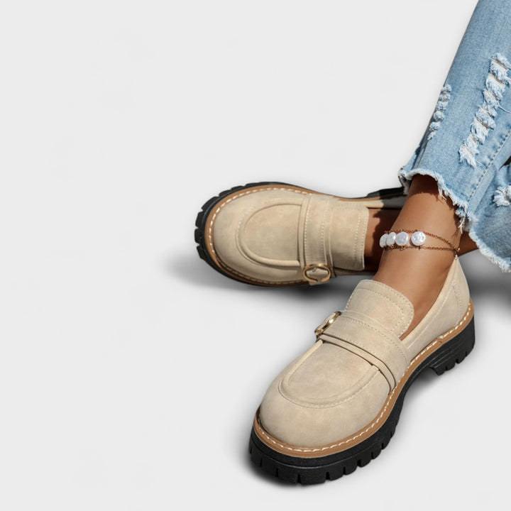 A woman wearing soft round-toe loafers with a casual everyday outfit