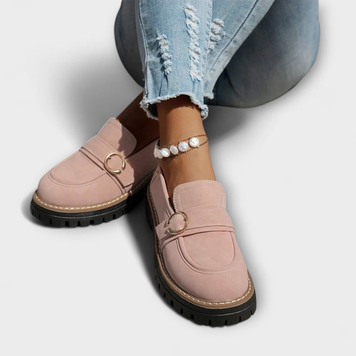 A woman wearing soft round-toe loafers with a casual everyday outfit