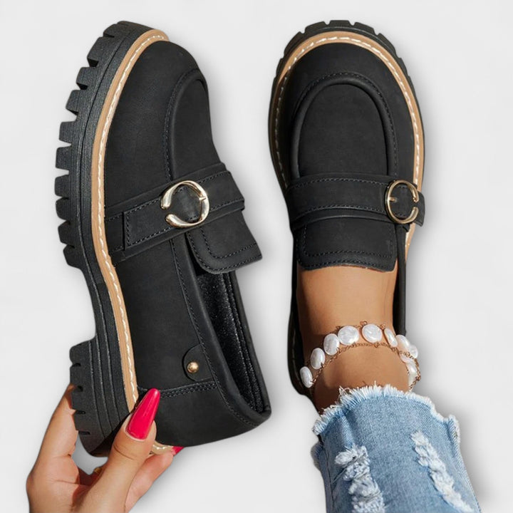 A woman wearing soft round-toe loafers with a casual everyday outfit