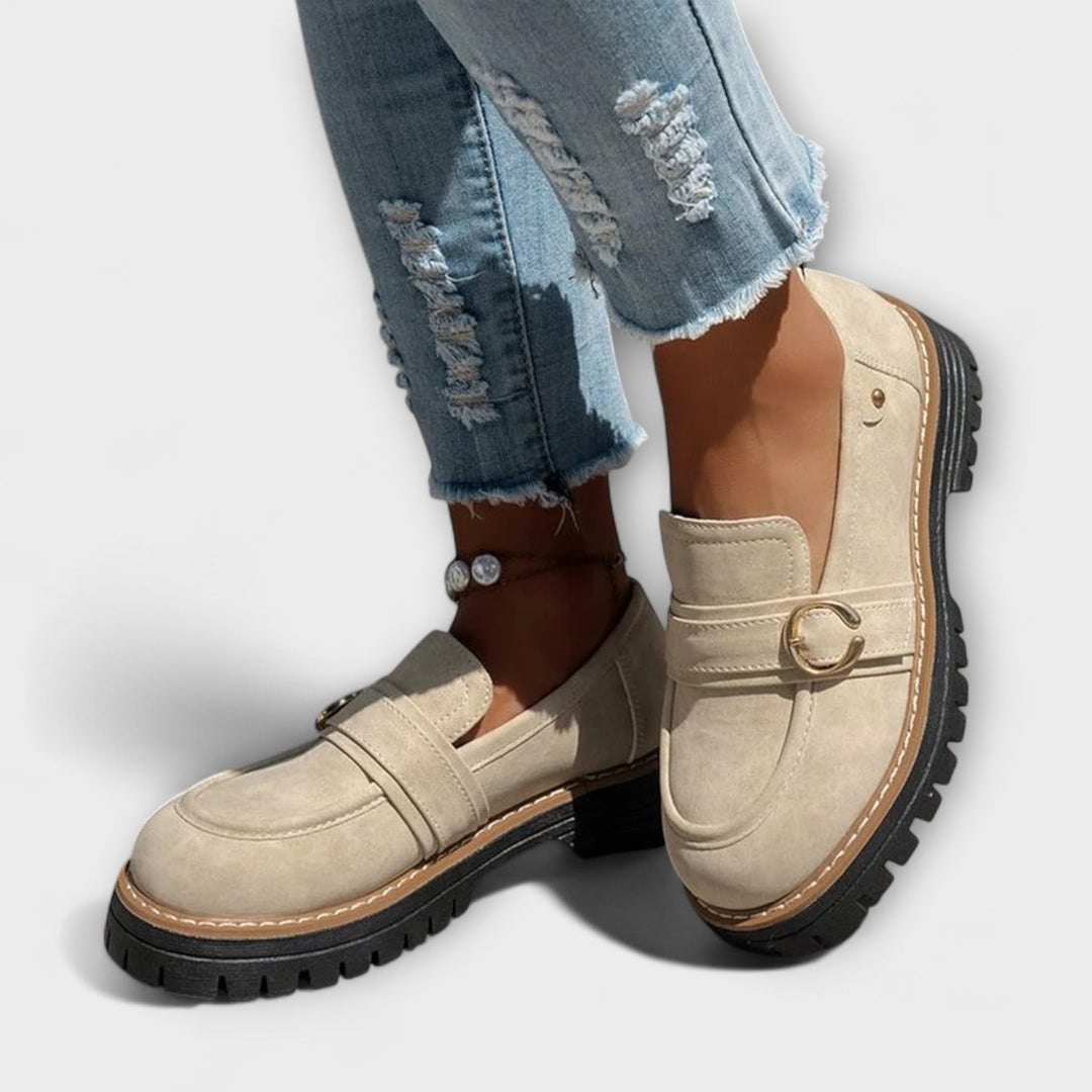A woman wearing soft round-toe loafers with a casual everyday outfit