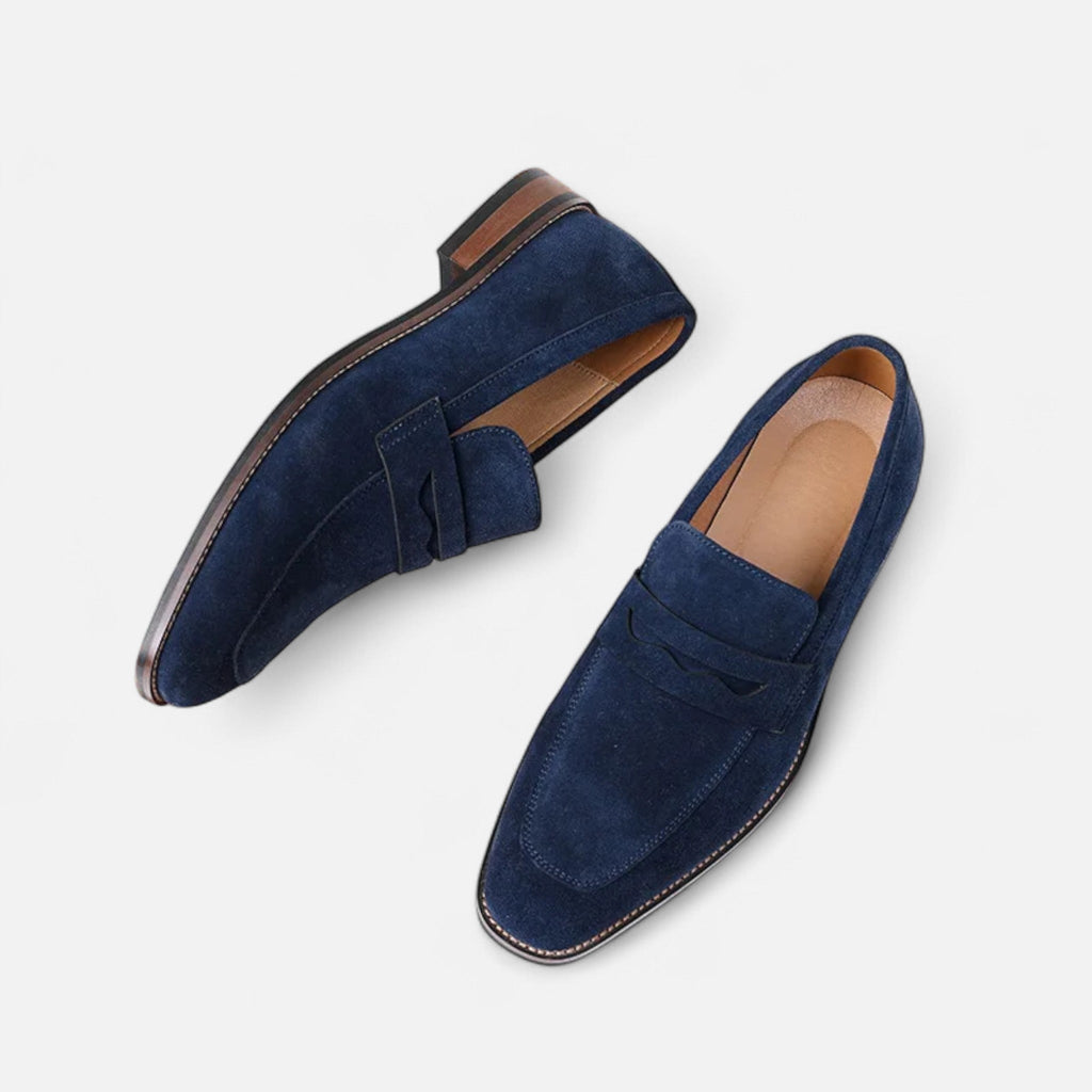 Men's tan coffee penny loafers with a clean structured upper and classic loafer silhouette