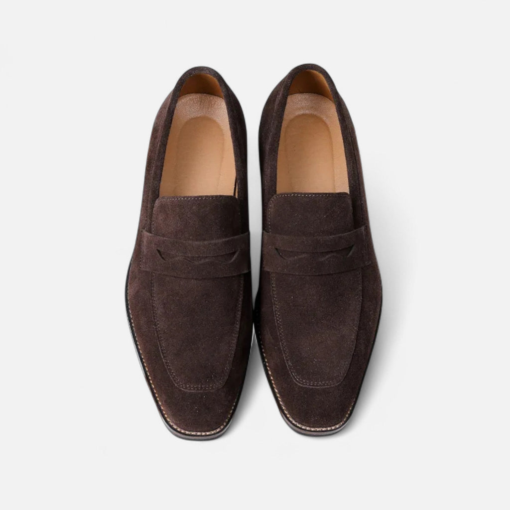 Men's tan coffee penny loafers with a clean structured upper and classic loafer silhouette