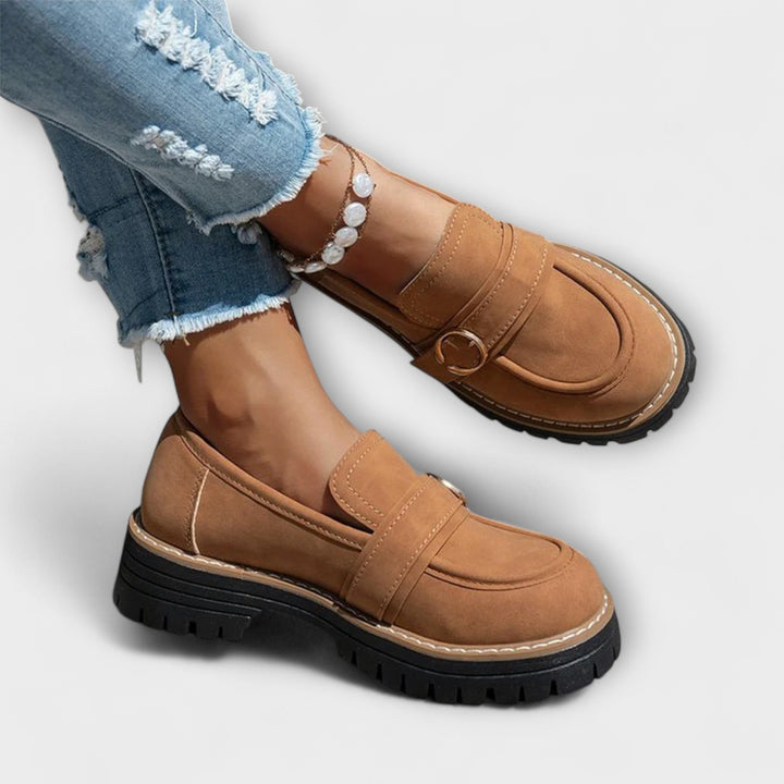 A woman wearing soft round-toe loafers with a casual everyday outfit