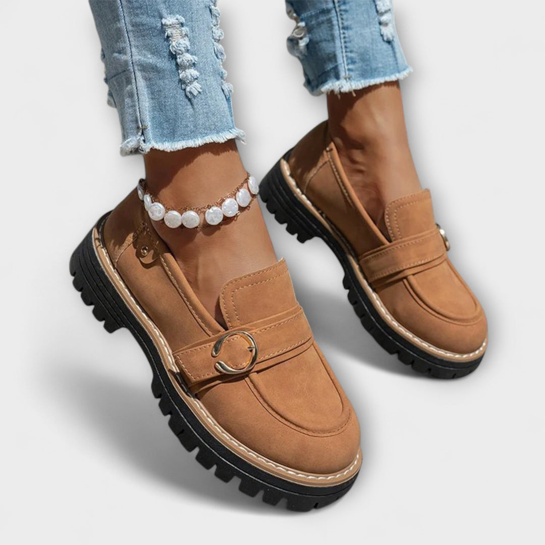 A woman wearing soft round-toe loafers with a casual everyday outfit