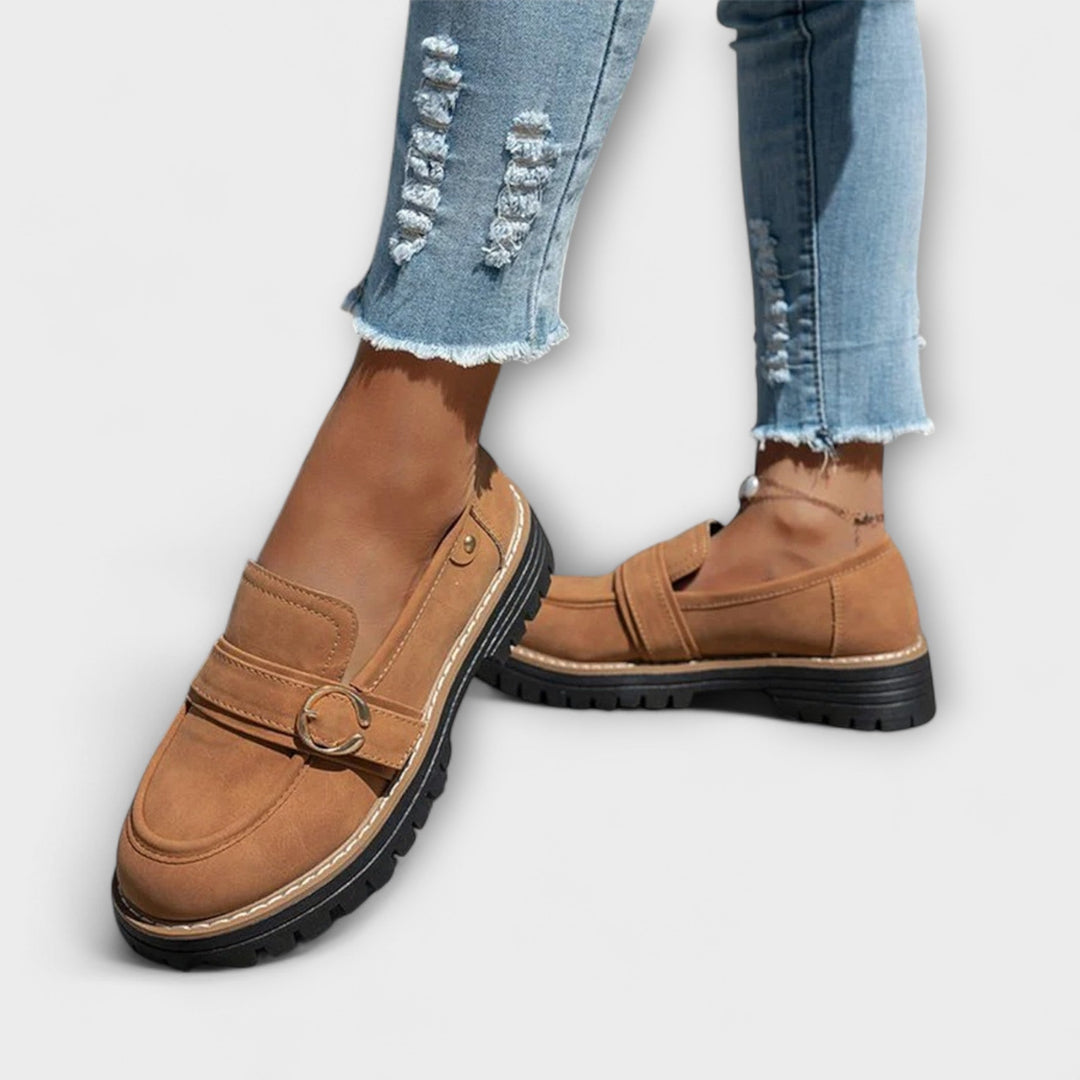 A woman wearing soft round-toe loafers with a casual everyday outfit