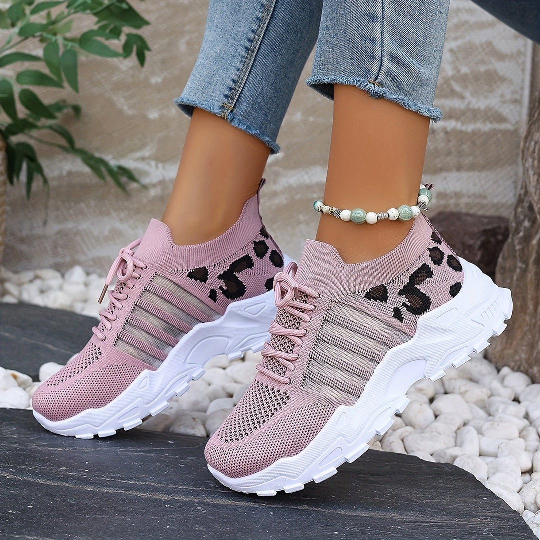 A woman walking in light, breathable comfort trainers on a warm day.