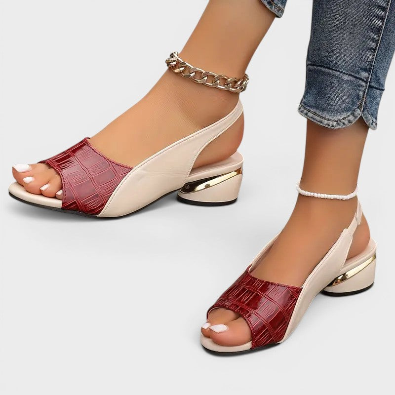 Women's peep-toe wedge sandals in red with an open toe and secure ankle strap