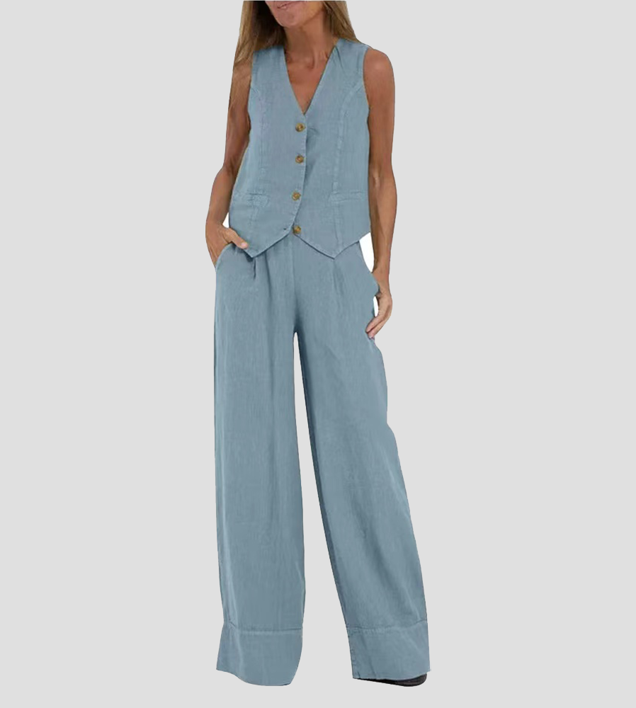 A woman wearing a tailored waistcoat with flowing wide-leg trousers