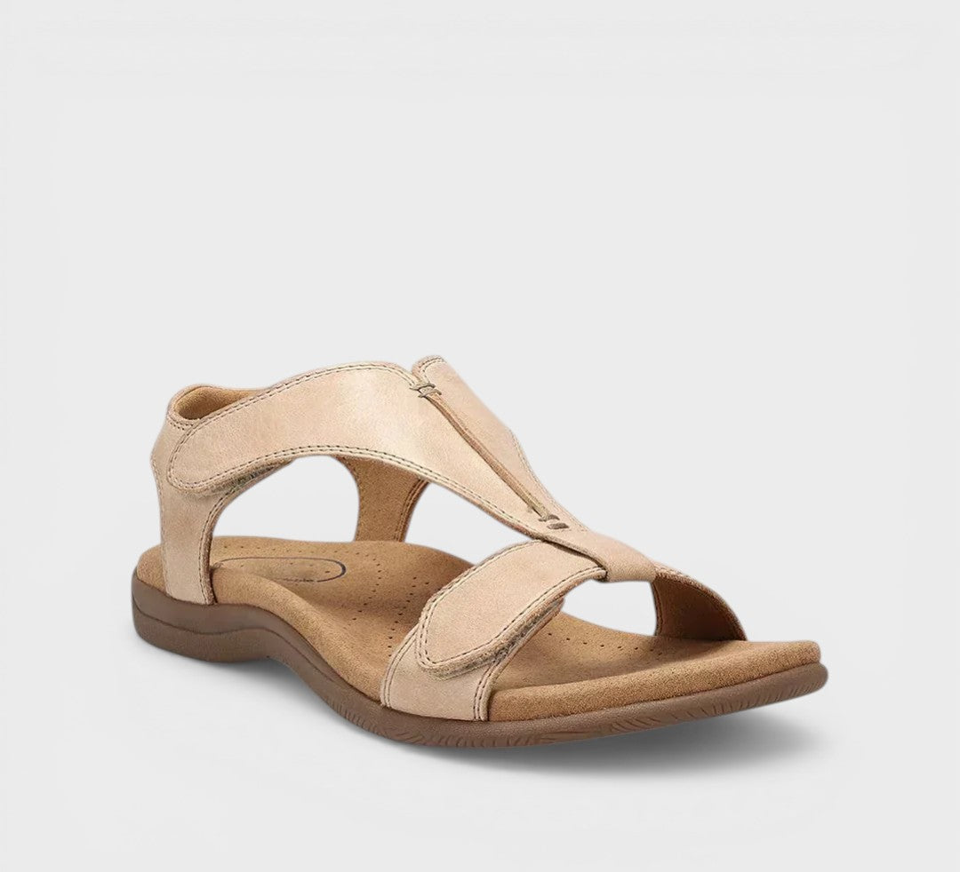 Elegant flat T-bar sandals in black and beige with a classic, refined strap design