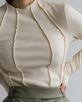 Apricot long-sleeve essential top with a clean, flattering and relaxed silhouette