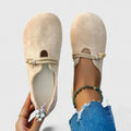 Beige backless ballet pumps with rounded toe and instep strap