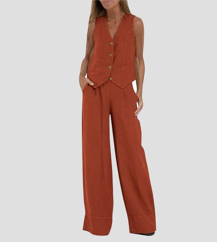 A woman wearing a tailored waistcoat with flowing wide-leg trousers