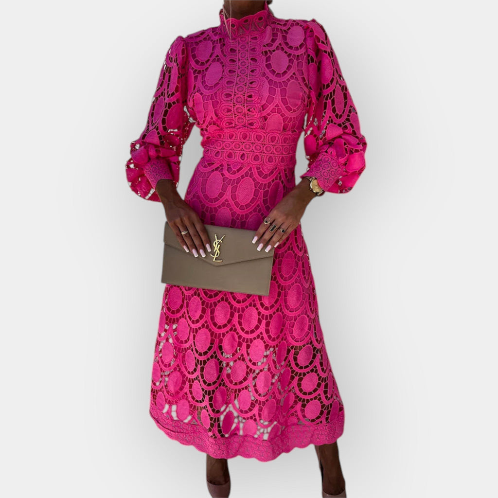 Romantic white openwork dress with voluminous puff sleeves and a graceful fitted silhouette