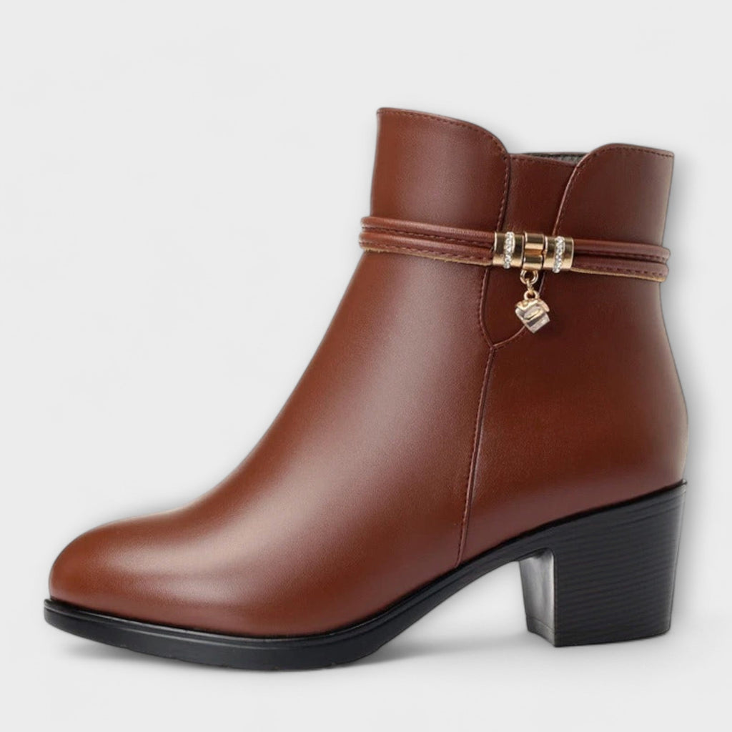 Heeled zip winter boots in brown and black with a smooth upper and elegant silhouette