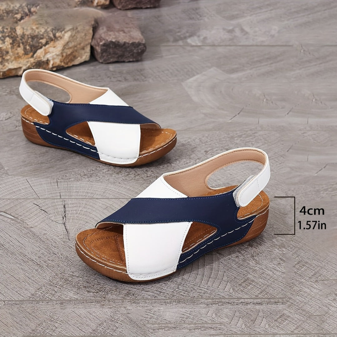 Women's wide-strap daily sandals in navy and white with a low supportive wedge