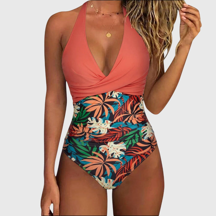 One-piece swimsuit with V-neckline and floral detail in a fresh green tone