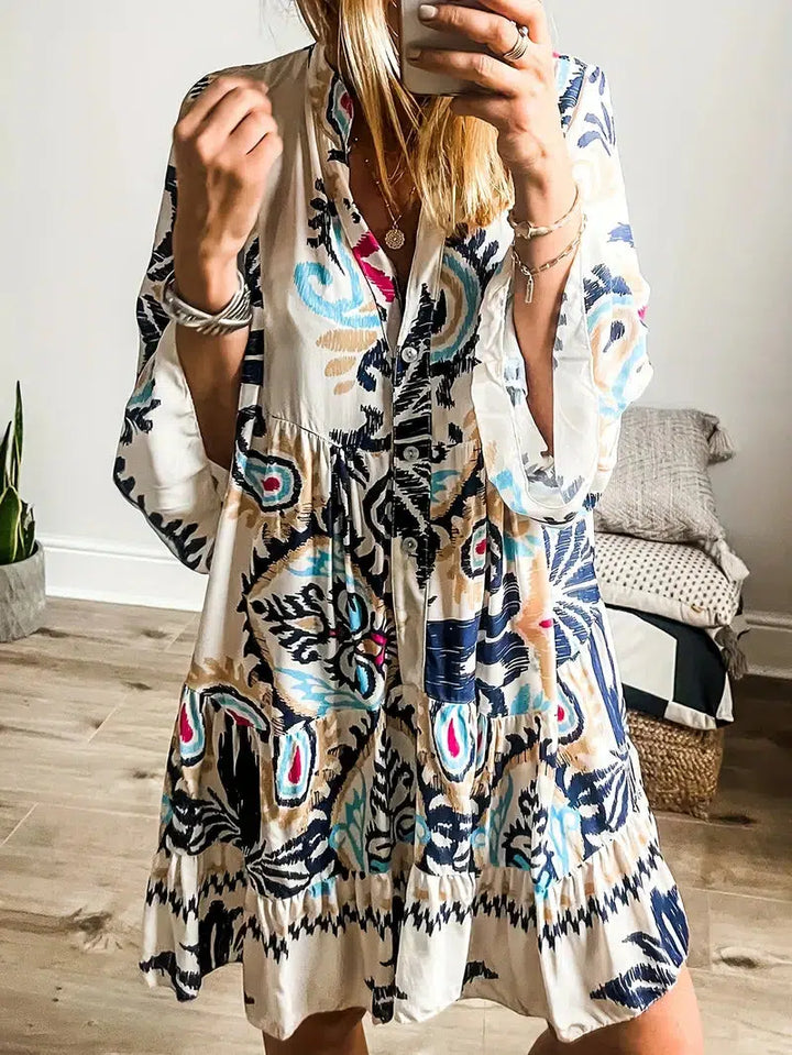 A woman wearing a relaxed boho print tunic dress on a warm, sunny day.