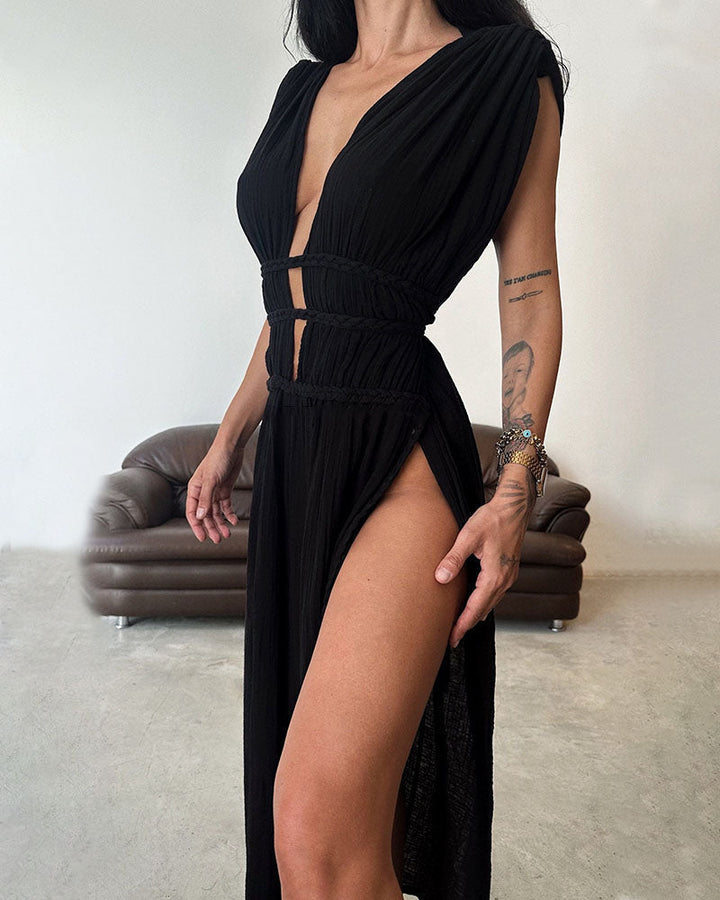 Woman in a softly textured dress with front slit and cinched waist tie at golden hour.