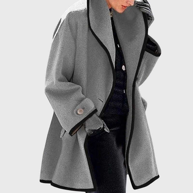 A woman wearing a double-breasted buttoned jacket on a cold day