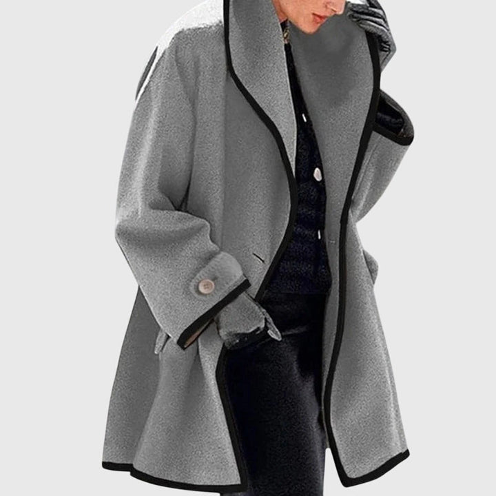 A woman wearing a double-breasted buttoned jacket on a cold day