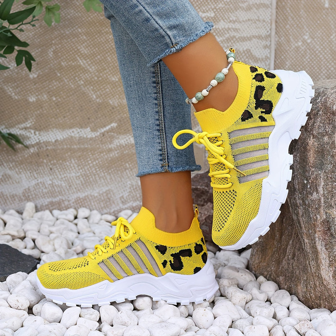 A woman walking in light, breathable comfort trainers on a warm day.