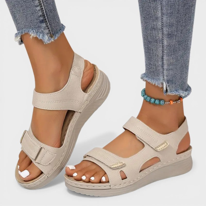 Cushioned comfort sandals in beige and black with adjustable velcro straps