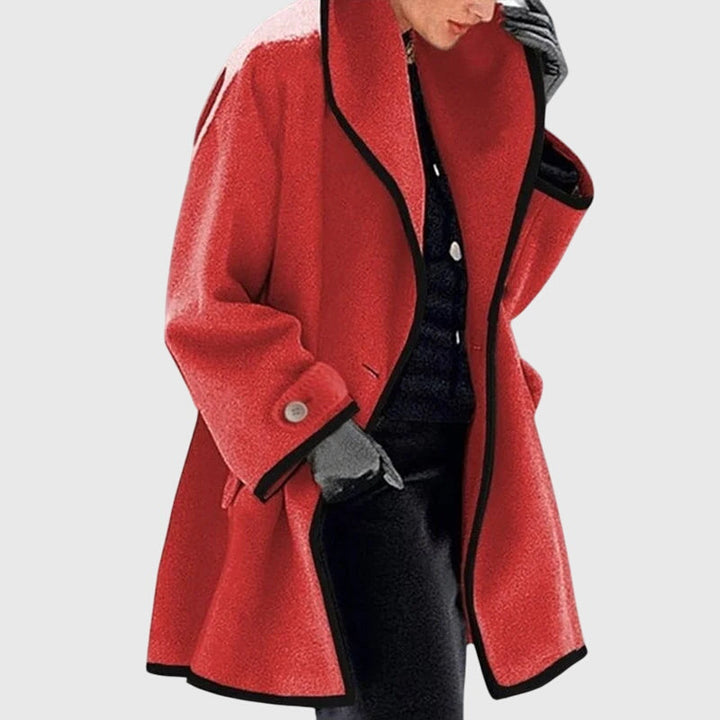 A woman wearing a double-breasted buttoned jacket on a cold day