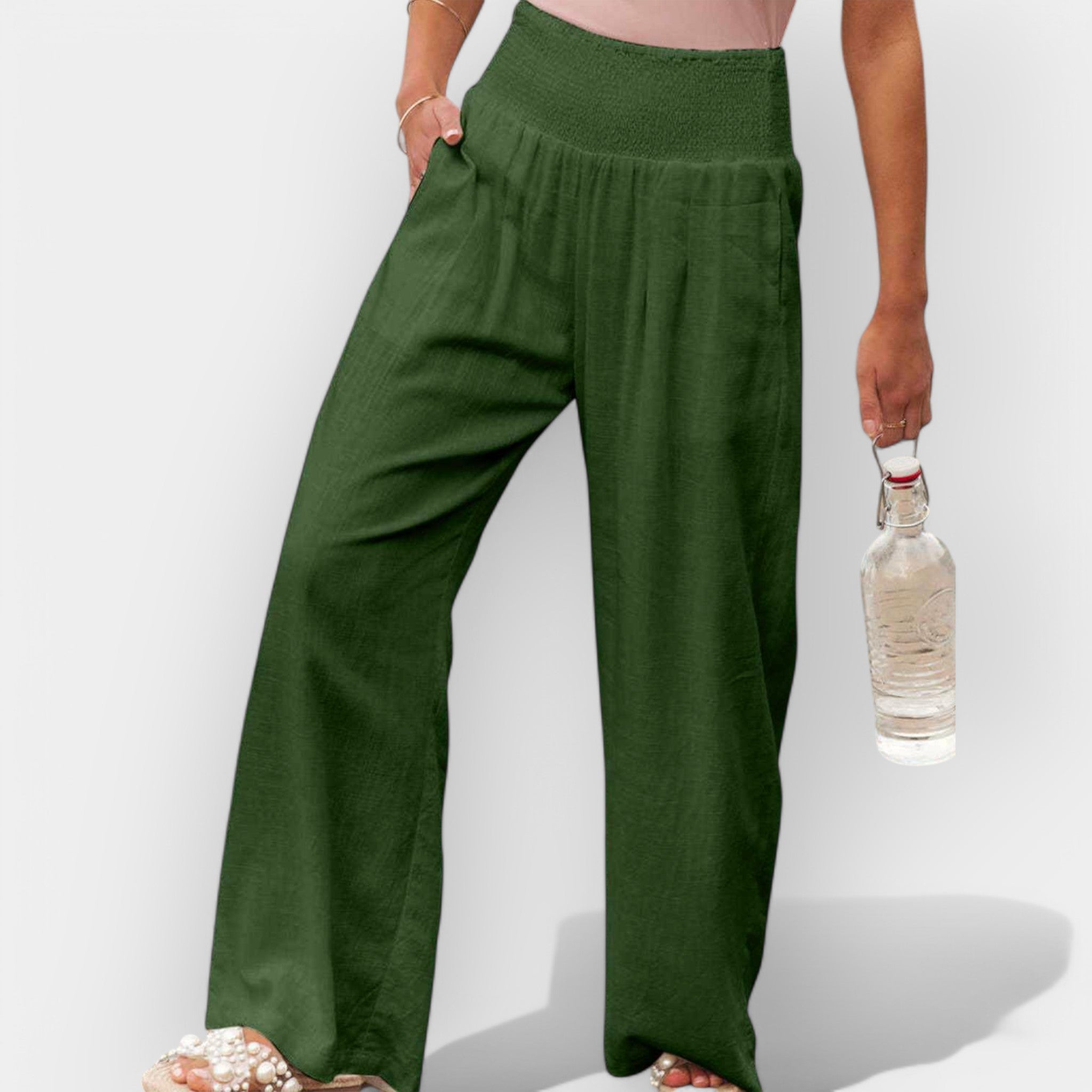 White wide-leg trousers with an elastic waist and a light, flowing silhouette