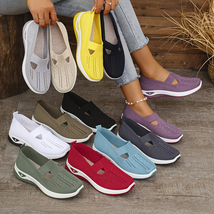 A woman stepping into easy slip-on comfort trainers with no laces.