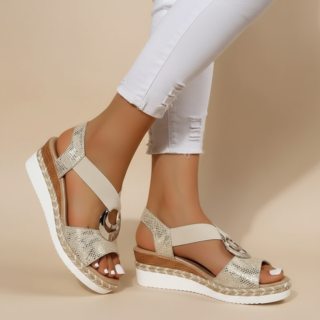 Gold platform sandals with metallic detail and ankle strap