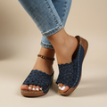 Blue scalloped wedge sandals with open design and cushioned base