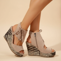 Boho wedge sandals in khaki with a trailing fringe detail at the back
