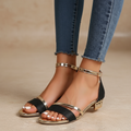 Low-heeled ankle strap sandals with a refined finish in black, rose gold, silver and gold