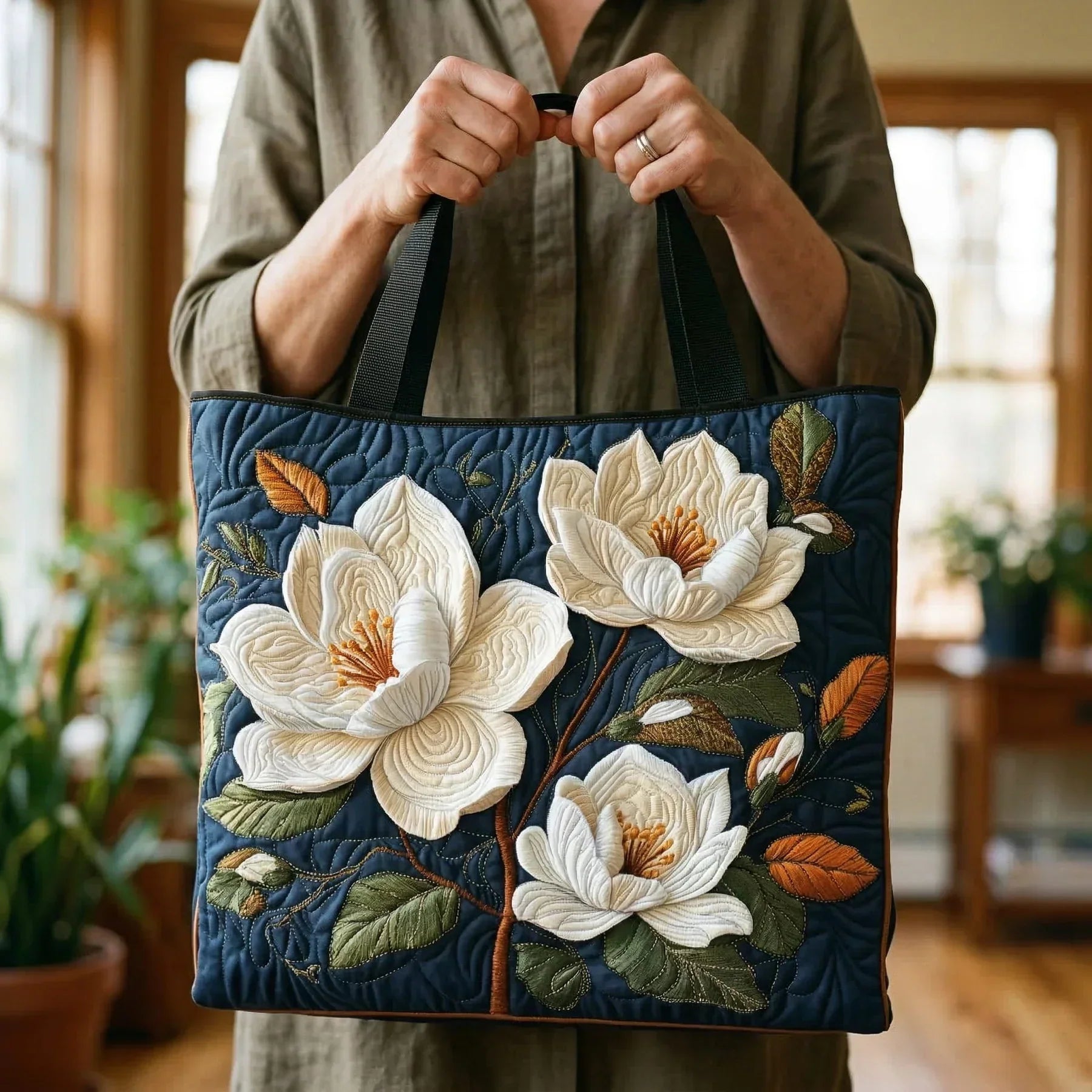 Quilted tote bag with a delicate magnolia floral print on a structured wave-stitch body