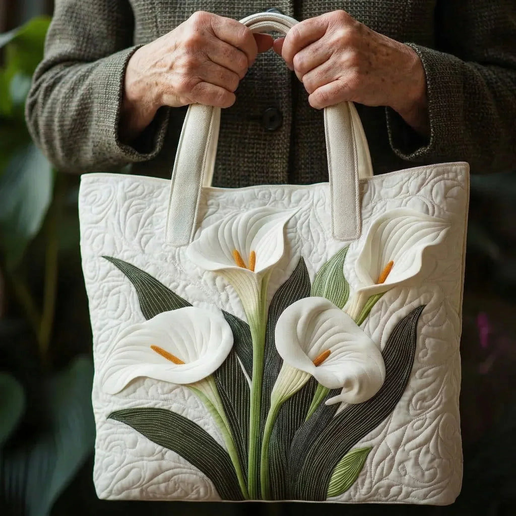 Quilted tote bag with a classic white lily floral print on a structured wave-stitch body