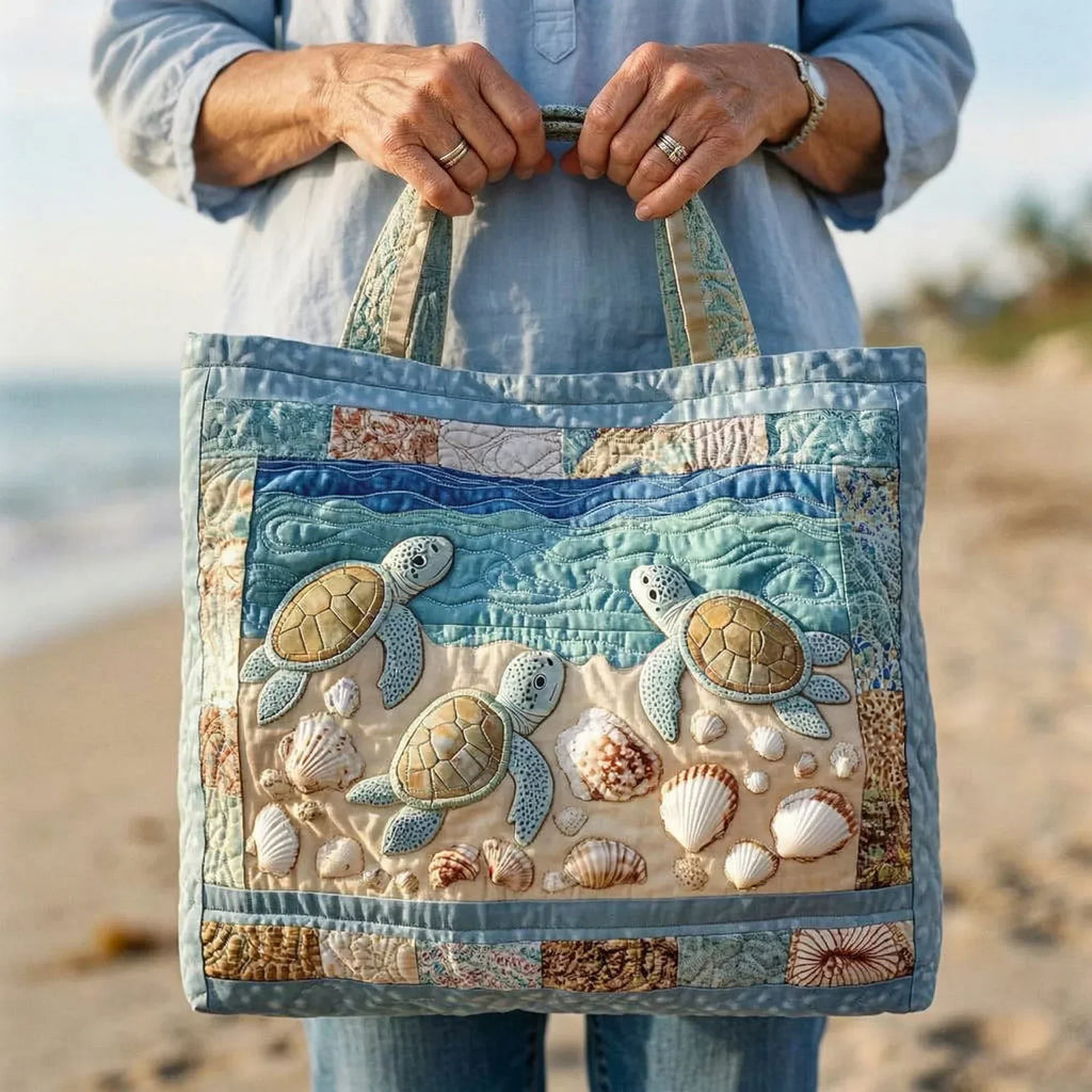 Quilted tote bag with sea turtles gliding through deep blue ocean water