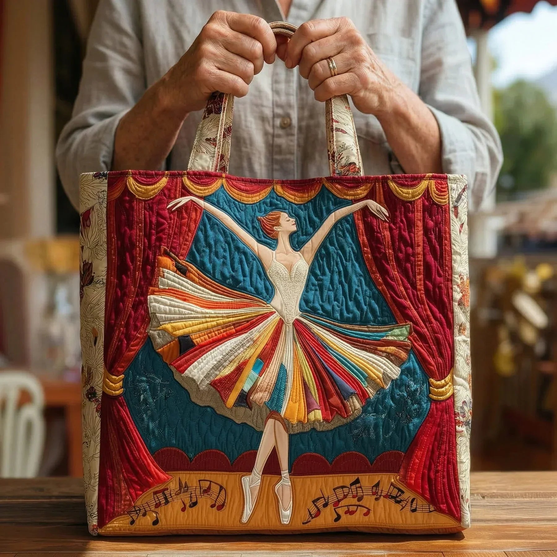 Quilted tote bag with an elegant ballerina in movement against a soft background