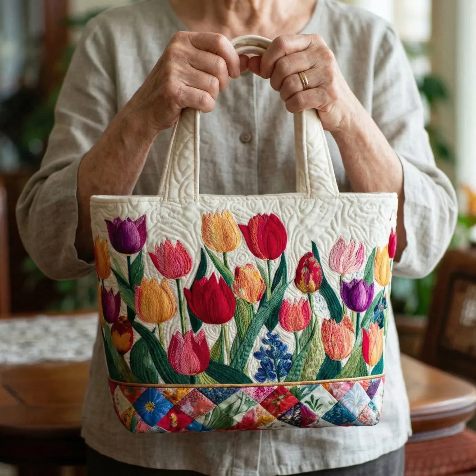 Quilted tote bag with a colourful tulip garden pattern and wave-stitch finish