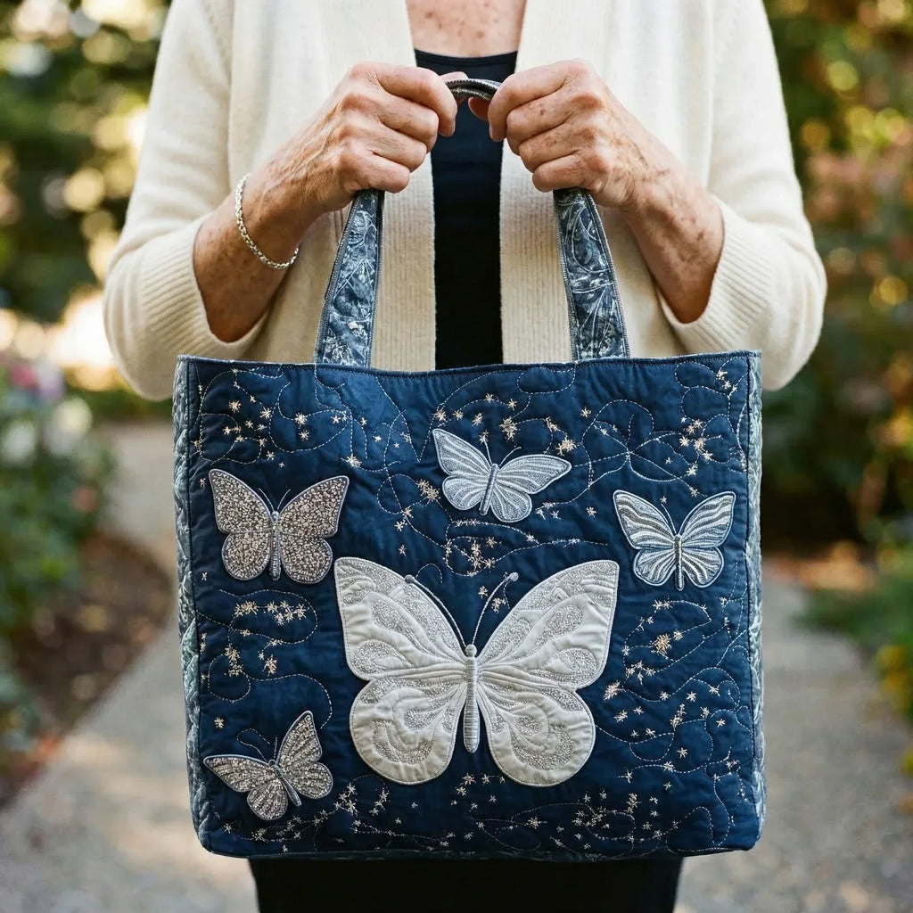 Quilted tote bag with a shimmering silver butterfly with delicate wing detail