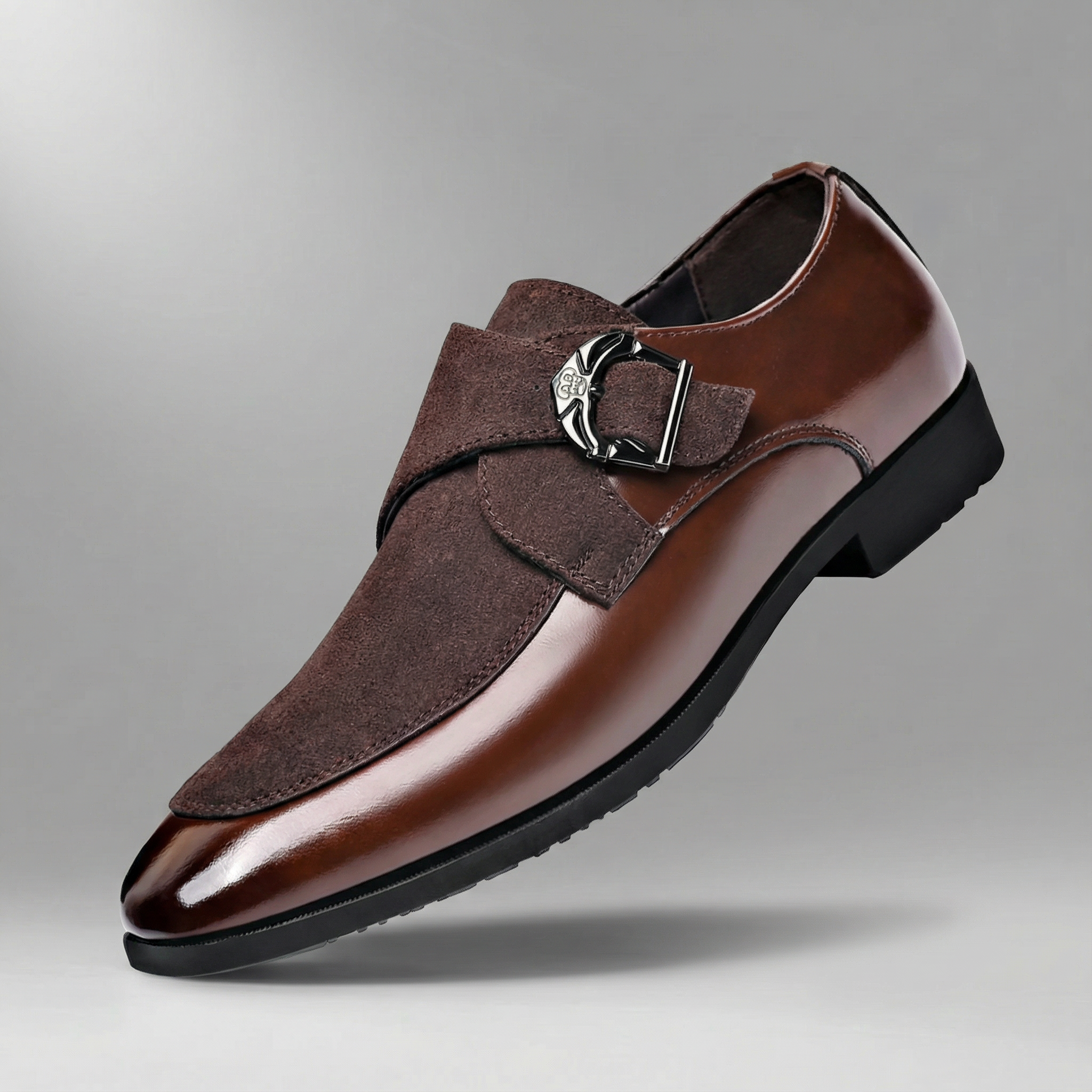 Men's brown monk strap shoes with a refined strap buckle and clean structured silhouette