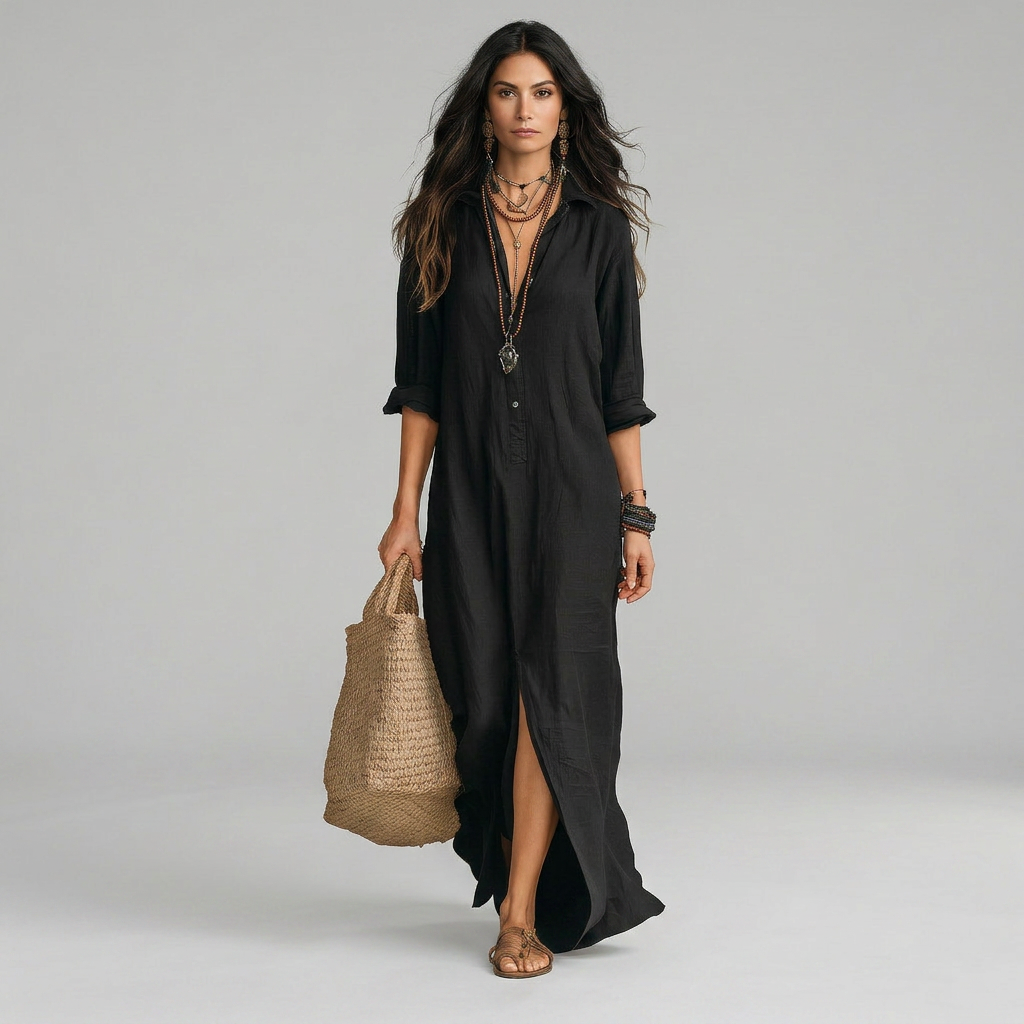 Elegant floaty maxi dress in black with a flowing full-length silhouette and structured bodice