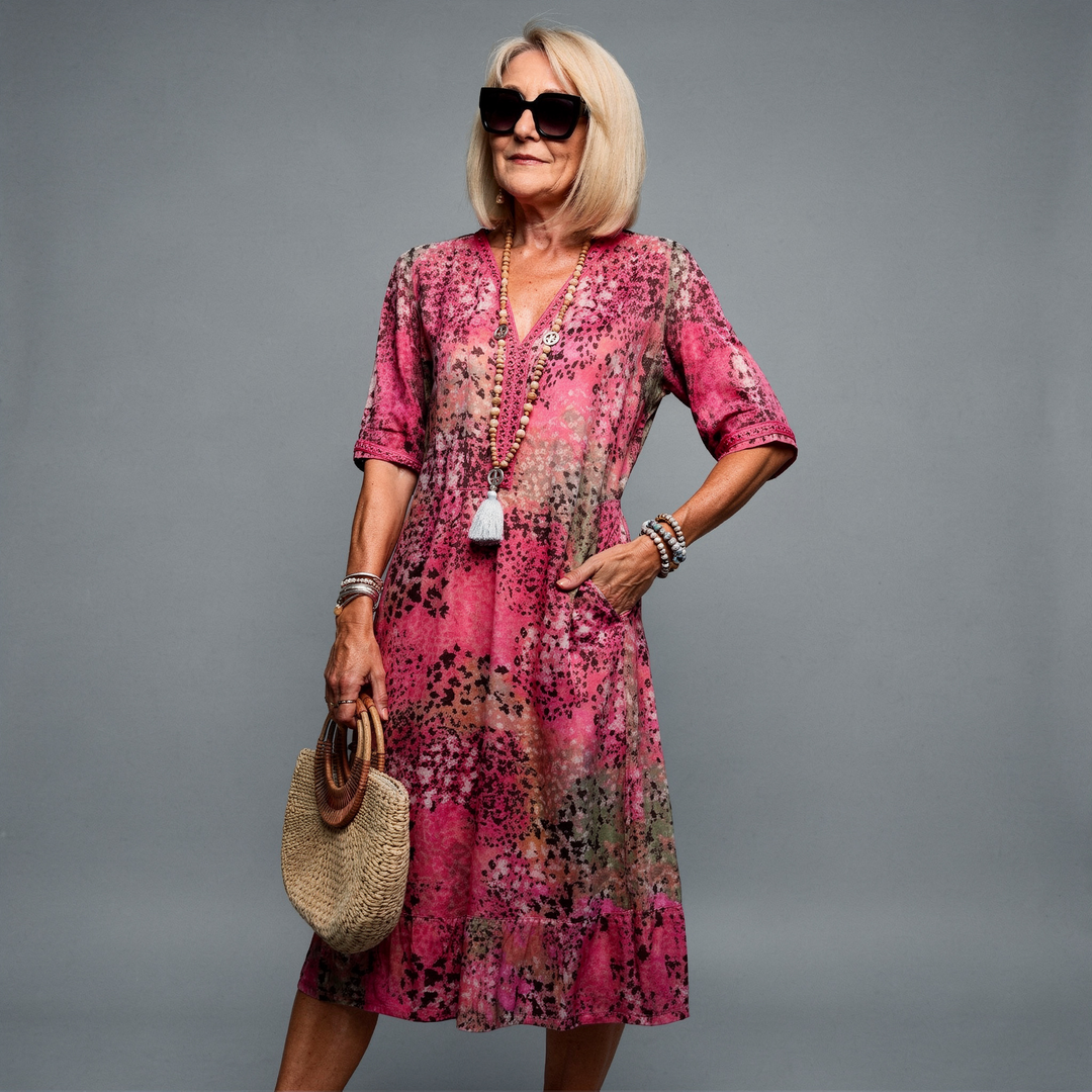 Vibrant midi dress in bold red with a fluid silhouette and relaxed feminine cut