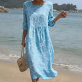 Flowing floral print maxi dress with a soft round neckline in a relaxed fit