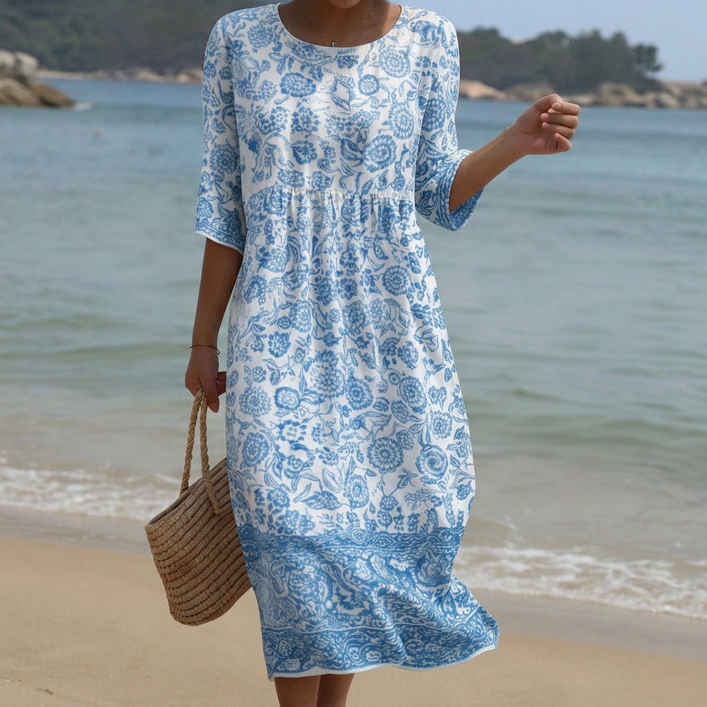 Flowing floral maxi dress with a round neckline and elegant relaxed silhouette